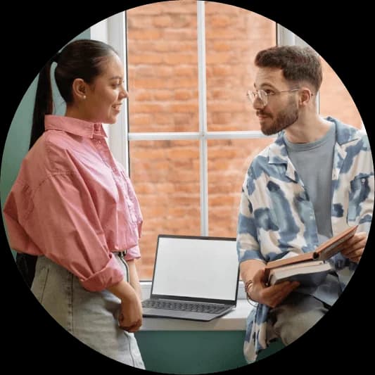 Two relocation consultants discussing temporary housing solutions for international employees - Globexs corporate relocation services