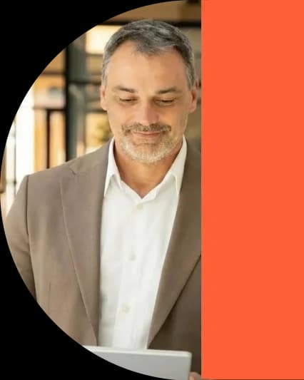 Experienced relocation specialist reviewing corporate housing options on tablet - Globexs Valencia expat services team member