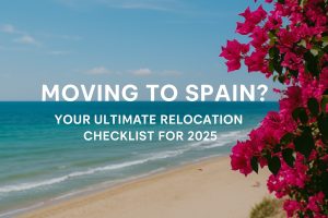 Spanish beach with turquoise sea and pink bougainvillea flowers – Moving to Spain? Your ultimate relocation checklist for 2025